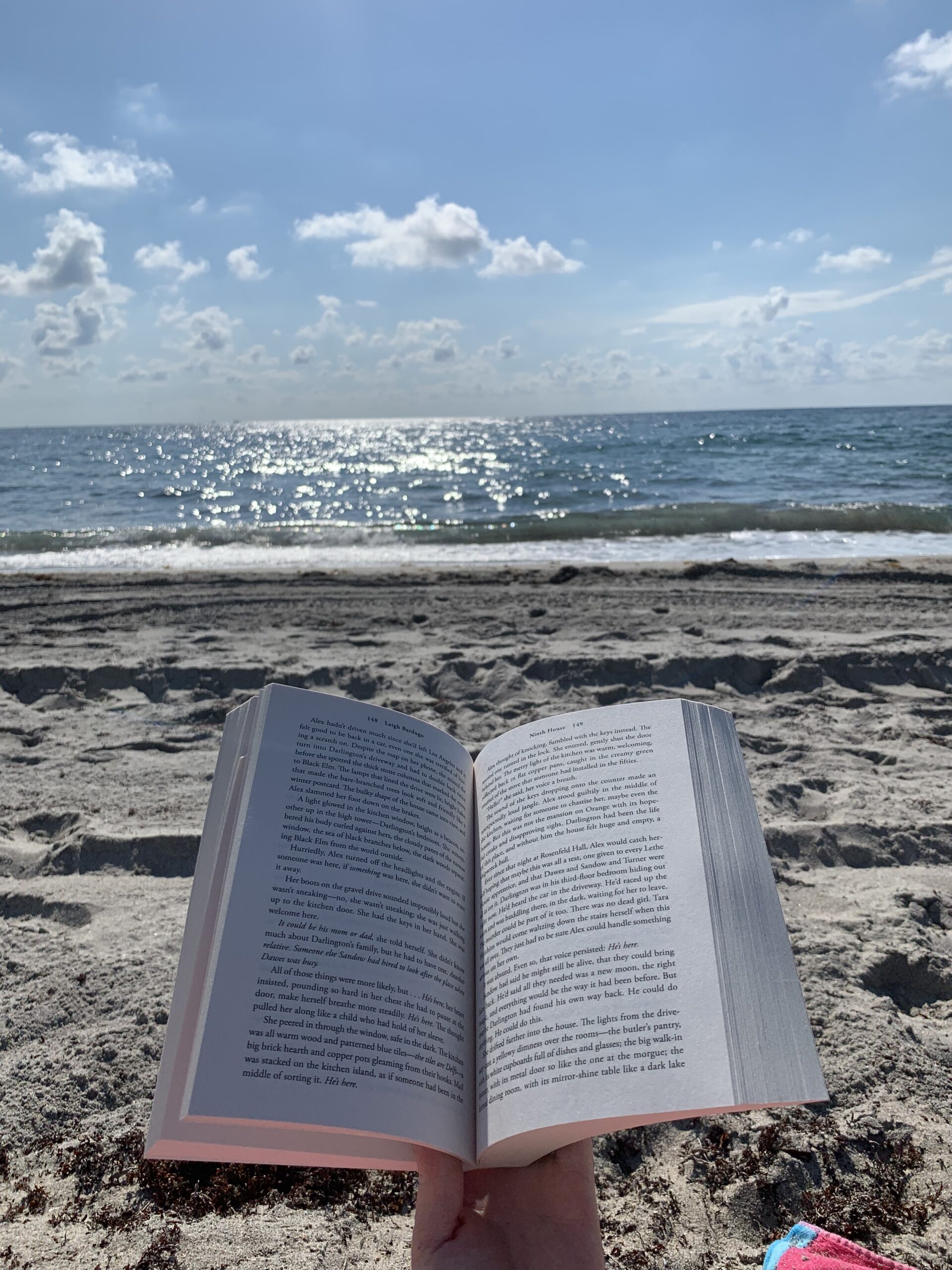 photo of a book at the beach